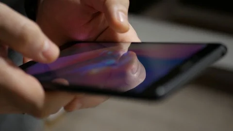 The hand (finger) work with phone touchscreen. Close up macro view 库存影片 126774018