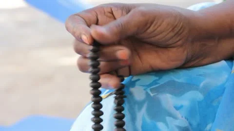 Hand fingering prayer beads (HD) c Stock Footage 11496086