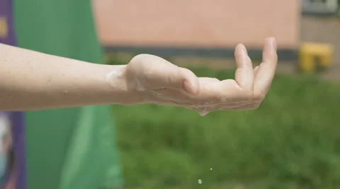 A hand with flammable substance is set on fire Stock Footage 64496798