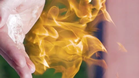 A hand with flammable substance is set on fire Stock Footage 91180716