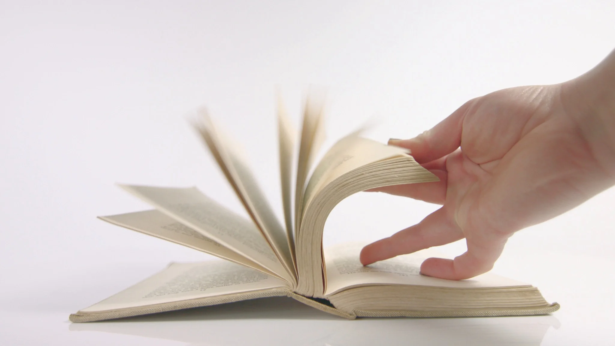 hand opening book on white background, Stock Video