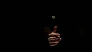 Hand Flipping A Euro Coin On Black Background Stock Footage