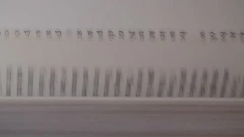 Hand flipping through a book Stock Footage 140314724