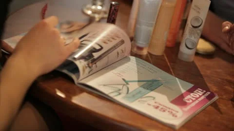 Hand flipping through catalog of cosmetics company. Stock Footage 22155464