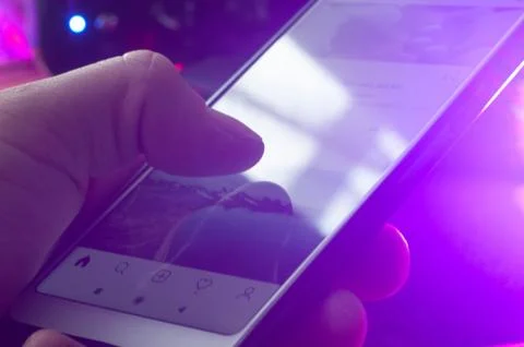 Hand flipping through feed close-up, social media addiction Foto stock