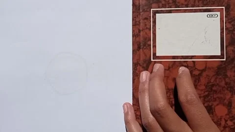 Hand flipping through a notebook with handwritten notes, math formulas Stock Footage 313728829