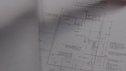 Hand flips through home blue prints Stock Footage 287257714