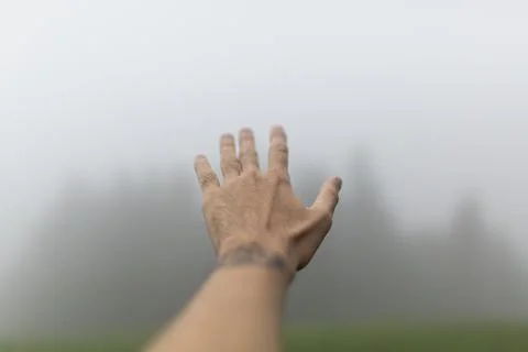 Hand on fog Stock Photos