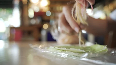 Hand folding Roti Sai Mai or cotton candy floss treat Stock Footage 121090486