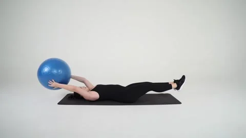 Hand to foot stability ball pass Stock Footage 314192498