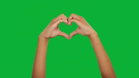 Hand forming heart shape on green screen background isolated element Stock Footage 313602354