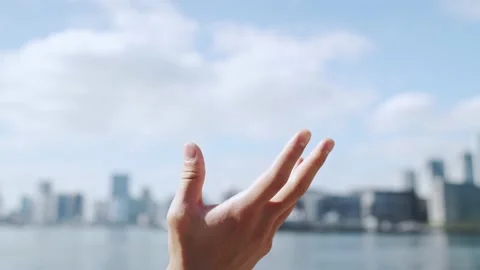 Hand in front of the city. Stock Footage 161546438