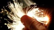Hand Full Of Brightly Lit Fibre Optic Cables. Fibre Optics Data Network. Stock Footage