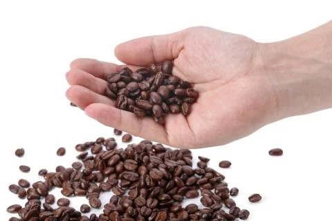 Hand full of coffee beans Stock Photos