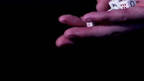 Hand full of poker dice ready to be rolled Stock Footage 147948010
