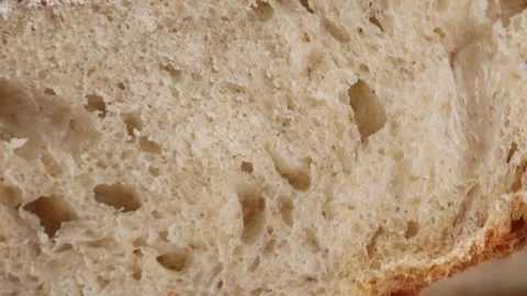 Hand gently pressing and squeezing soft fresh bread crumb in closeup view Stock Footage 311511557