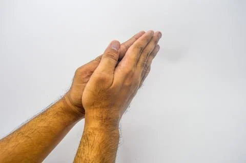 A hand gesture of apologizing or shaking hands or greetings Stock Photos