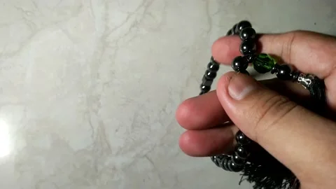 Hand gesture moving islamic prayer beads Stock Footage 238998907
