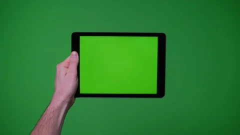 Hand gesture pack holding up ipad smart device on greenscreen Video stock 89759295