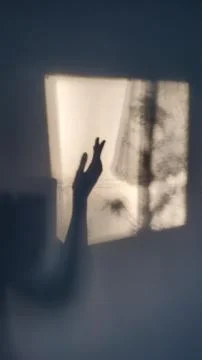 Hand gesture shadow on rough wall surface Stock Photos
