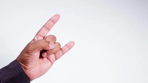 A Hand Gesture shows Devils Horns Stock Footage 248698948