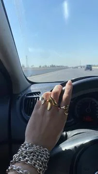 Hand Gesture While Driving on Highway in Daytime 写真素材