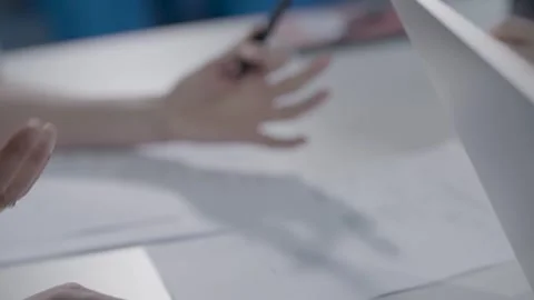 Hand Gestures and Papers on Desk During Workplace Discussion or Meeting Stock Footage 334055106