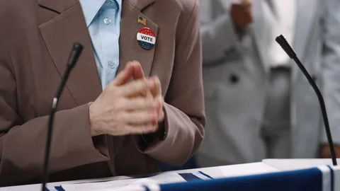 Hand Gestures of Anonymous Female Candidate Speaking at Election Debate Stock Footage 266459219