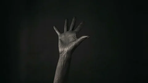 Hand gestures. Black painted woman's hand pointing up with finger number five Stock Footage 100682450
