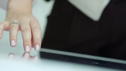 Hand gestures on a digital tablet with blurred background Video stock 345708355
