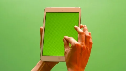 Hand gestures on modern tablet with green screen. Production proven tracking mar Stock Footage 91523997