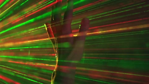 The hand gesturing on a laser rays background Video stock 191482031