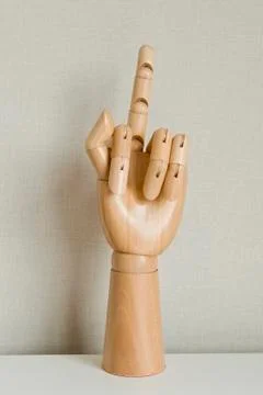 Hand Gesturing With Middle Finger On White Background Stock Photos