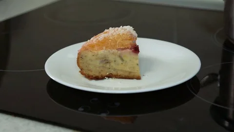 Hand get away a piece of cake with a plate Stock Footage 74870968