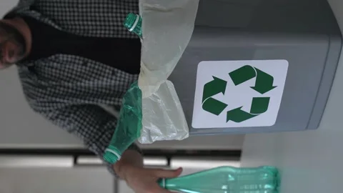 Hand getting plastic bottles to dispose in garbage box ready to recycle Stock Footage 196623934