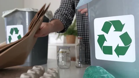 Hand getting plastic bottles to dispose in garbage box ready to recycle Stock Footage 196624131