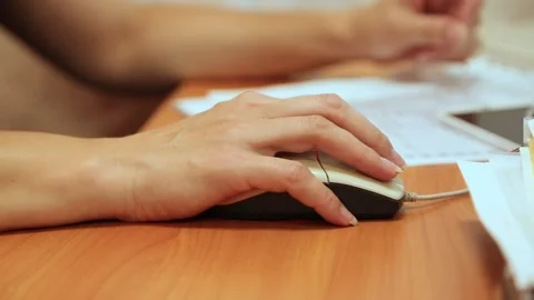 Hand of a girl with a computer mouse Stock Footage 91386115