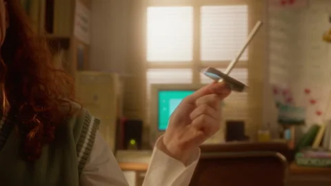 Hand of Girl Spinning Floppy Disk on Pen in Vintage Computer Room Stock Footage 343642256