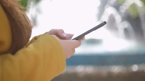 Hand of girl using texting mobile phone or chat. Close up of woman hand 4K Video stock 252203546