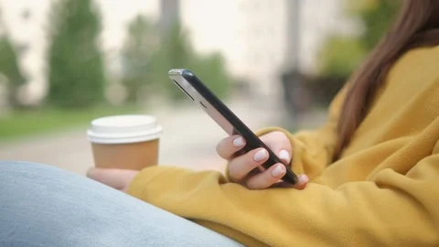Hand of girl using texting mobile phone or chat. Close up of woman hand 4K Stock Footage 252203987