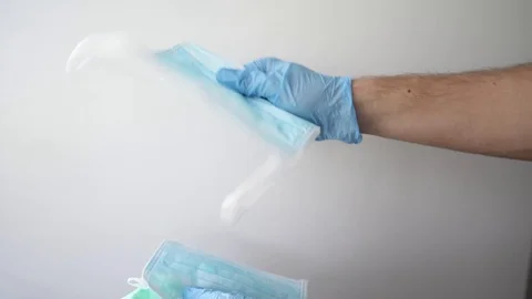 A hand give a face mask, shortage or surging high demand of respiratory mask Stock Footage 127216976