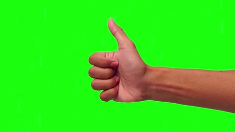 Hand gives clear thumbs-up gesture against vibrant green background Stock Footage 295538167