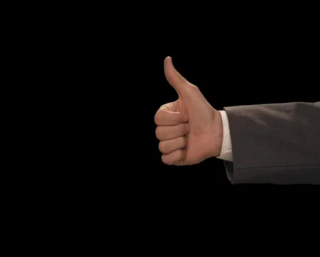 Hand gives Thumbs Up then Down Stock Footage 754522