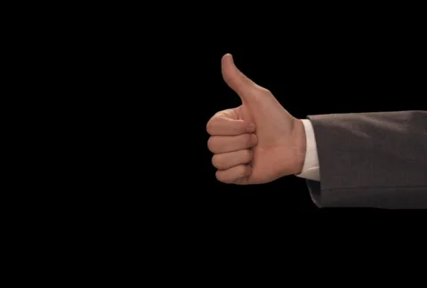 Hand gives Thumbs Up then Down Stock Footage 754523