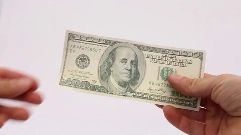 Hand giving 100 dollars Stock Footage 72035026