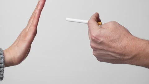 Hand giving a cigarette to another hand, close-up Stock Footage 261844709