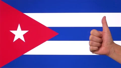 Hand giving thumb up with Cuba flag, approval gesture with copy space Vídeo Stock 84787629