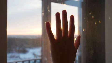 Hand On Glass And Sun Rays Of Sunset Sunshine Through Your Fingers Stock Footage 148755345