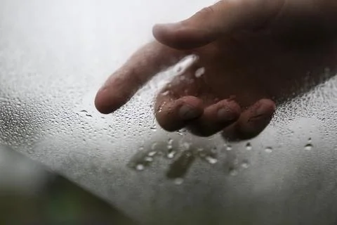 Hand in glass Stock Photos