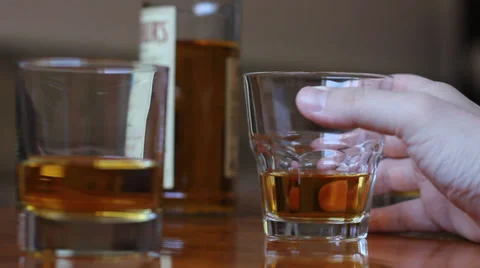 Hand with glass of whiskey Video stock 38936738